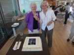 Michelle Cavanagh & Brigitte Lucey propose a toast before cutting the cake